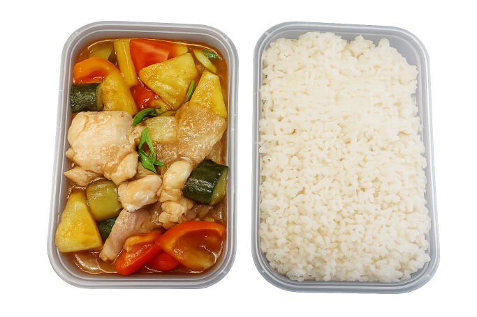Sweet and sour stir-fry with steamed rice in takeaway containers